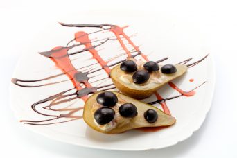 Delicious pears on a white background, professional chef cooked in the restaurant.